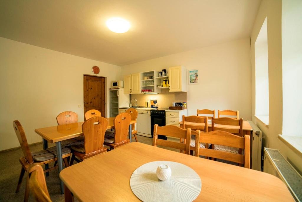 Shared fully equipped kitchen and dining room at Pension 222